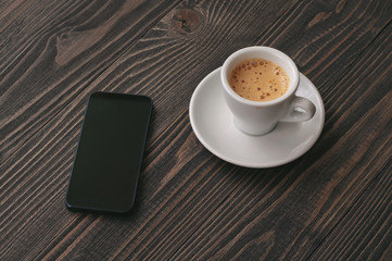 smartphone with cup of espresso