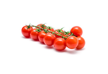 tomatoes with green leaves isolated on white background