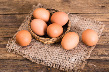chicken eggs on wooden background