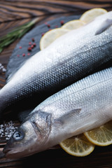 Close-up of fresh uncooked seabass, selective focus, studio shot