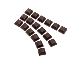 Slices of dark chocolate on a light background