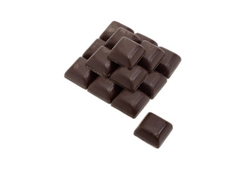 Pieces of dark chocolate on a light background