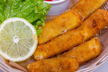 Fried Mozzarella cheese sticks, closeup