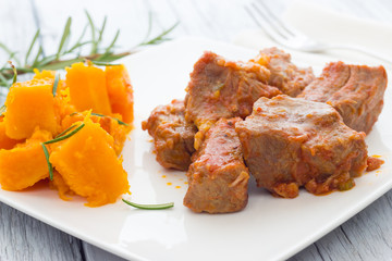 Pork stew garnished with pumpkin
