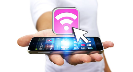 Young man using modern mobile to connect with wifi