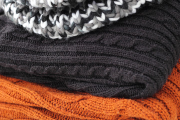 stack of warm winter knitted sweaters