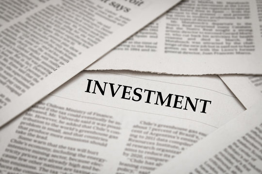 investment news headline on newspaper