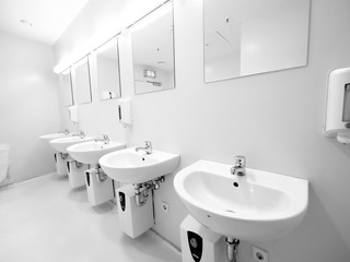 Naklejka na ściany i meble a clean new public toilet room empty