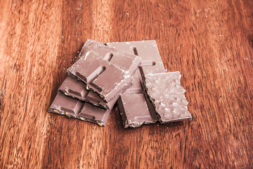 Chocolate on wood background, made vintage color tone