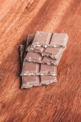 Chocolate on wood background, made vintage color tone