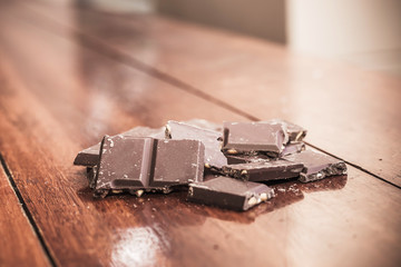 Chocolate on wood background, made vintage color tone