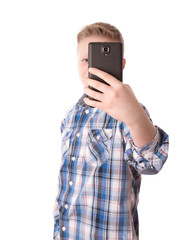 Child take a photo with his phone isolated on white