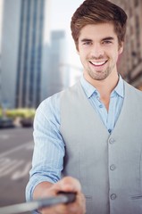 Composite image of portrait of happy businessman holding selfie stick