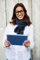 Smiling woman using digital tablet 