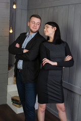 Attractive loving couple in a stylish interior. These feelings, smiles, kisses.