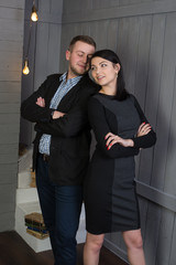 Attractive loving couple in a stylish interior. These feelings, smiles, kisses.