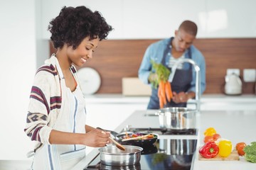 Fototapeta premium Happy couple preparing meal