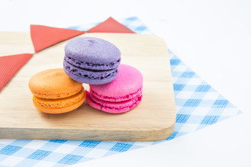 Colorful macaroons variety closeup on wood. concept resentation
