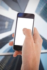 Composite image of cropped hand of man using mobile phone