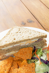 Ham and Egg Sandwiches With Salad and Nachos