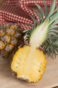 Pineapple on wood board.