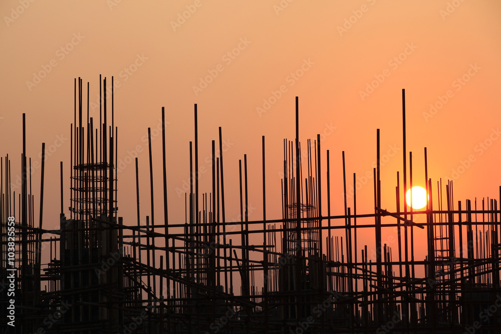 Wall mural steel structure buildings under the setting sun