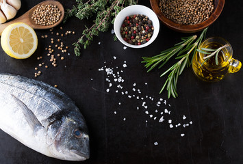 Fresh fish dorado with fragrant spices, herbs and spices