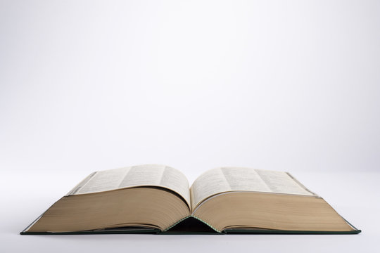 Big book open on white background