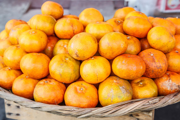 fresh mandarin group on basket from market