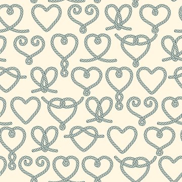 Seamless pattern made of rope hearts decorative knots