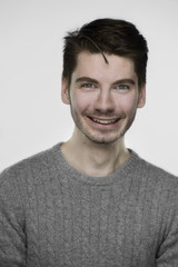 Fototapeta premium Young handsome guy portrait in front of white background