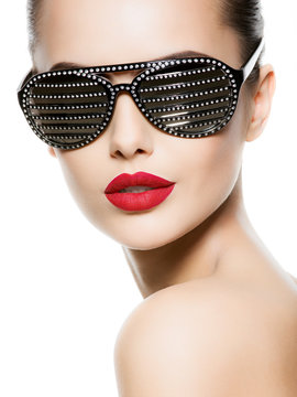 Fashion portrait of  woman wearing black sunglasses with diamond
