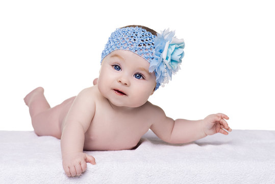 Little Baby Girl With Blue Bow Flower On Her Head