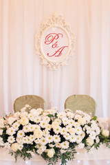 wedding table of the groom and bride with white daisies
