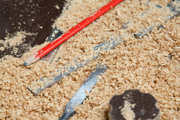 carpenter tools lying on wood chips