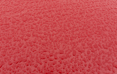 Rain drops on metal car surface.