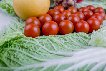 Tomato cherry heart on table background.Shape heart of tomatoes on table background with lettuce