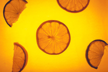 Slices of lemon isolated on yellow.Lemon slices on yellow background.