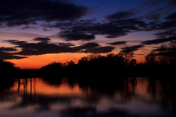 Fototapeta na wymiar Lake at sunset with reflection