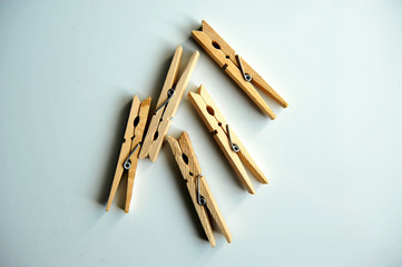 wooden clothespins on the white background