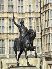Fototapeta na wymiar Richard I, (Richard the Lionheart) statue at the Houses Of Parliament in Westminster, London, England, UK, which was created by Baron Carlo Marochetti and completed in 1867