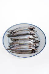 Capelin on a plate isolated on white background