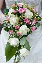 Wedding flowers in hands of the bride