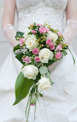 Wedding flowers in hands of the bride