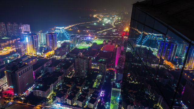 shenzhen city night roof view reflection mirror building 4k time lapse china
