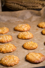 Tasty homemade oat cookies on baking tray.