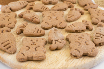  figure ginger snaps on a wooden board