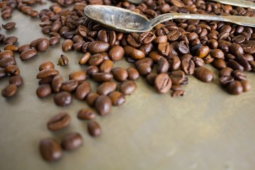 Vintage old spoon and coffee beans