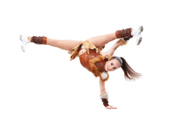 Young professional cheerleader dressed in a warrior costume standing on one hand. Horizontal splits