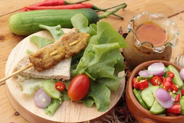 Pork satay,grilled pork with peanut sauce .